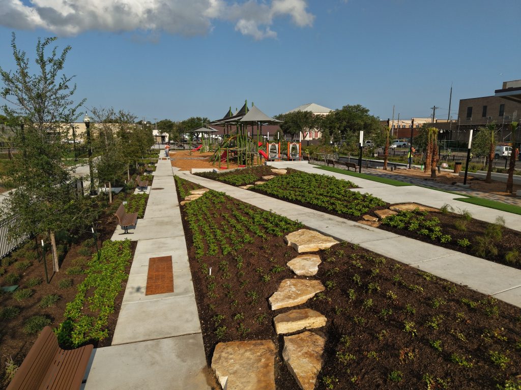 The newly built Texas City Community Plaza on 6th Street featuring pedestrian paths, landscaping, and public pavilions.